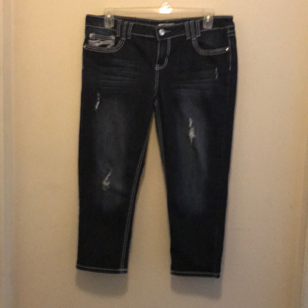A pair of capris jeans
